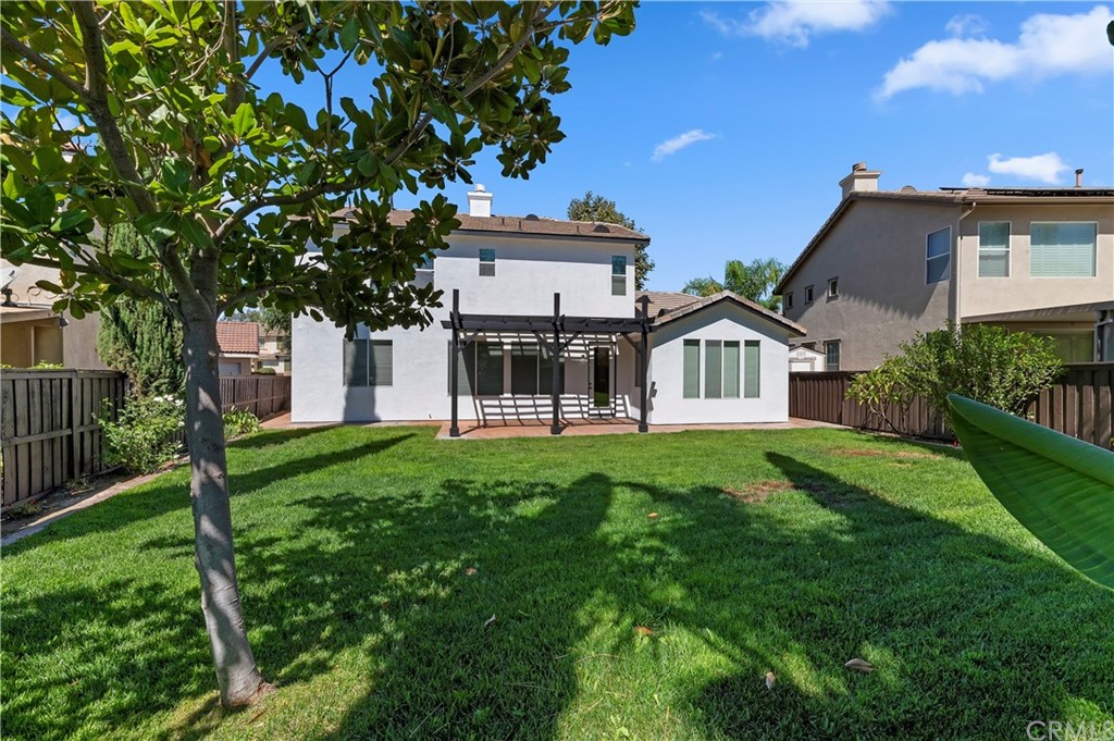 13527 Jasper Loop Eastvale, CA 92880 - Photo 36 of 37 a front view of a house with a garden