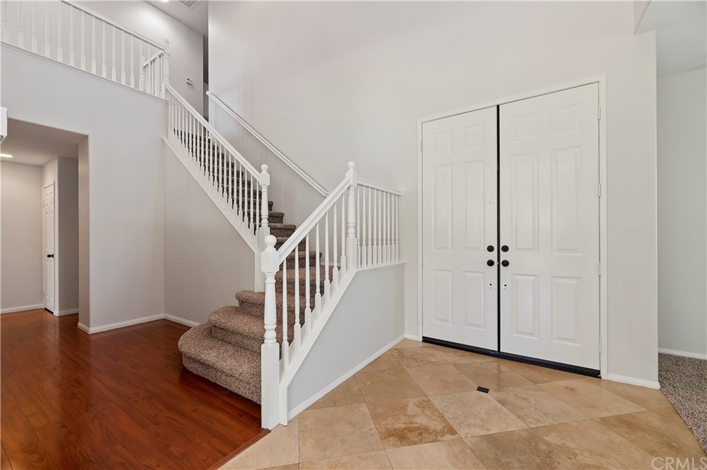 13527 Jasper Loop Eastvale, CA 92880 - Photo 6 of 37 a view of entryway and hall with wooden floor