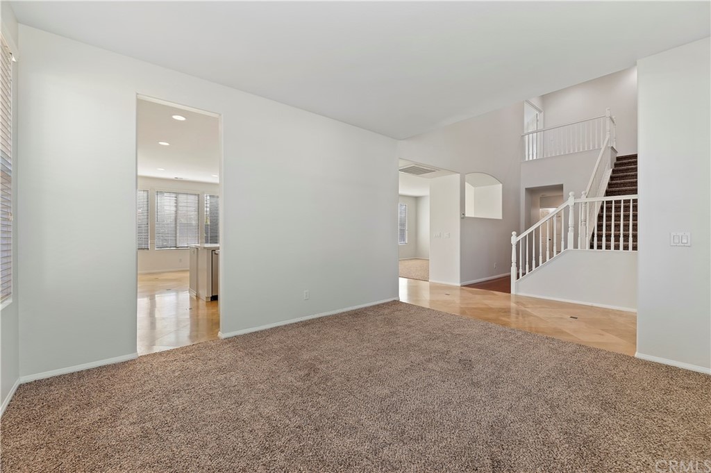 13527 Jasper Loop Eastvale, CA 92880 - Photo 9 of 37 a view of an empty room with stairs