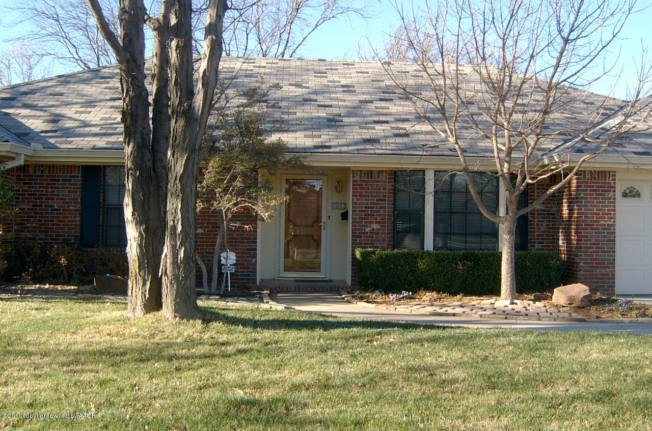 6903 Calumet Road Amarillo, TX 79106 - Photo 2 of 34 a view of a house with a yard