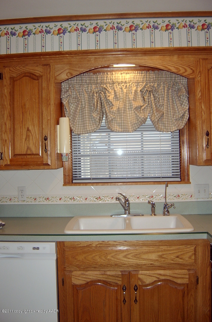 6903 Calumet Road Amarillo, TX 79106 - Photo 9 of 34 a bathroom with a sink and a mirror