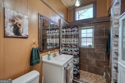 39 Shady Crk Ridge Marble, NC 28905 - Photo 15 of 64 a bathroom with a sink a toilet and shower