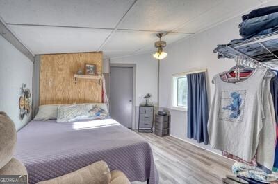 39 Shady Crk Ridge Marble, NC 28905 - Photo 20 of 64 a bedroom with a bed and a chandelier