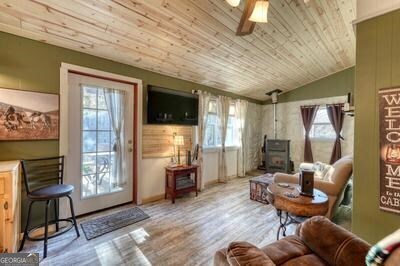 39 Shady Crk Ridge Marble, NC 28905 - Photo 2 of 64 a living room with furniture and a flat screen tv
