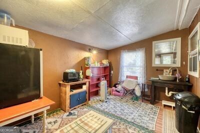 39 Shady Crk Ridge Marble, NC 28905 - Photo 23 of 64 a living room with furniture and a flat screen tv