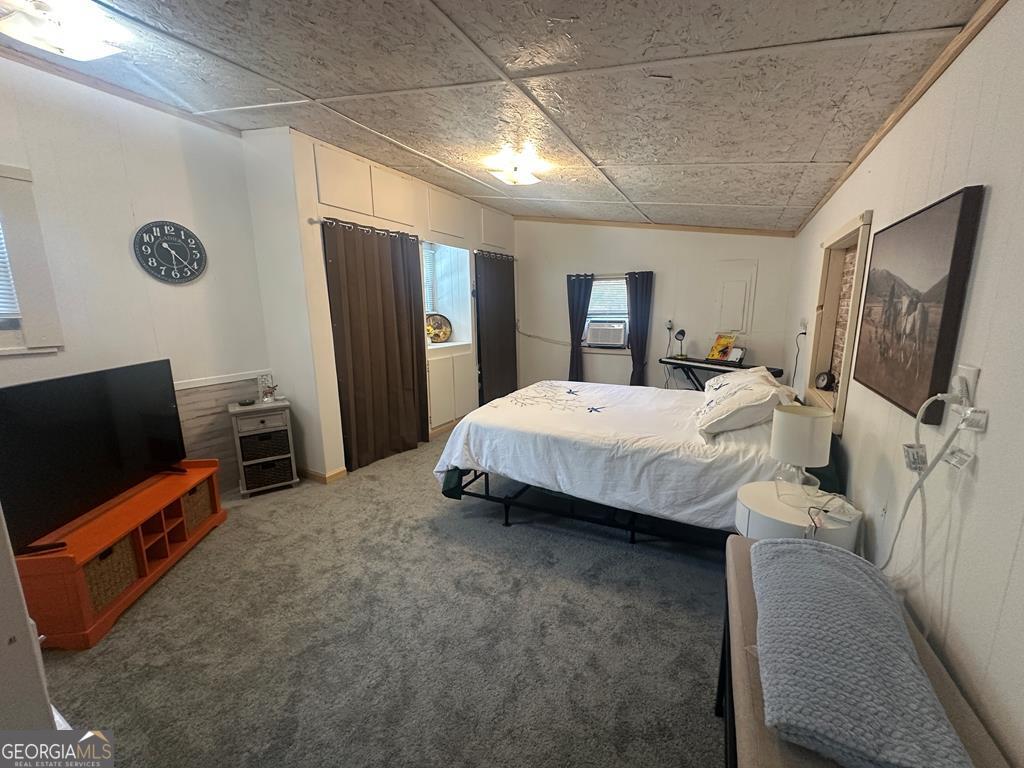 39 Shady Crk Ridge Marble, NC 28905 - Photo 56 of 64 a bedroom with a bed and a flat screen tv