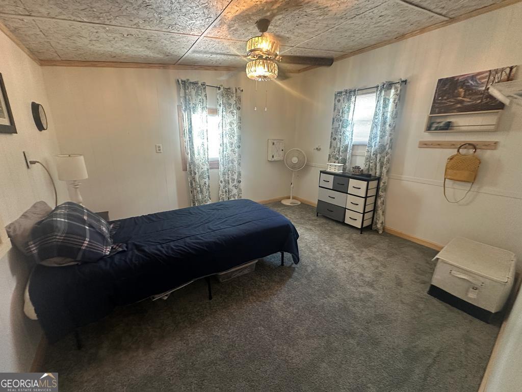 39 Shady Crk Ridge Marble, NC 28905 - Photo 58 of 64 a bedroom with a bed and dresser with mirror