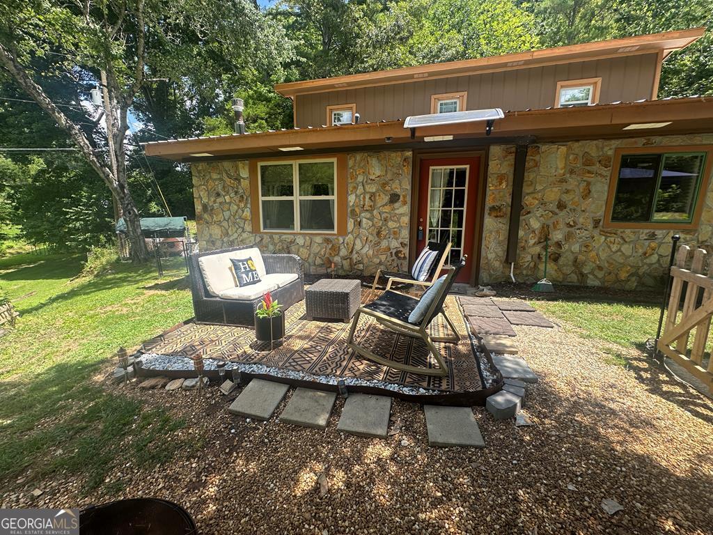 39 Shady Crk Ridge Marble, NC 28905 - Photo 64 of 64 a view of a house with backyard sitting area and garden
