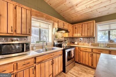 39 Shady Crk Ridge Marble, NC 28905 - Photo 9 of 64 a kitchen with stainless steel appliances granite countertop a stove a sink dishwasher and a microwave oven with cabinets