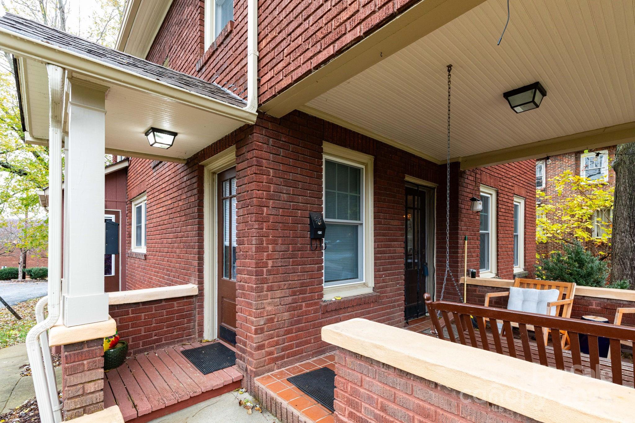 16 Gracelyn Road Asheville, NC 28804 - Photo 12 of 22 a view of a patio with a table and chairs