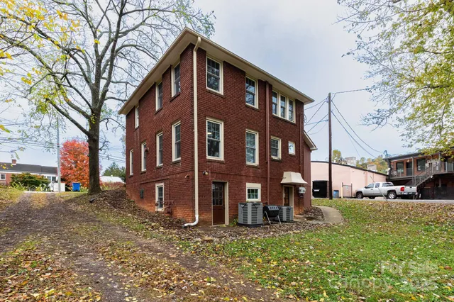 a view of a building with a yard