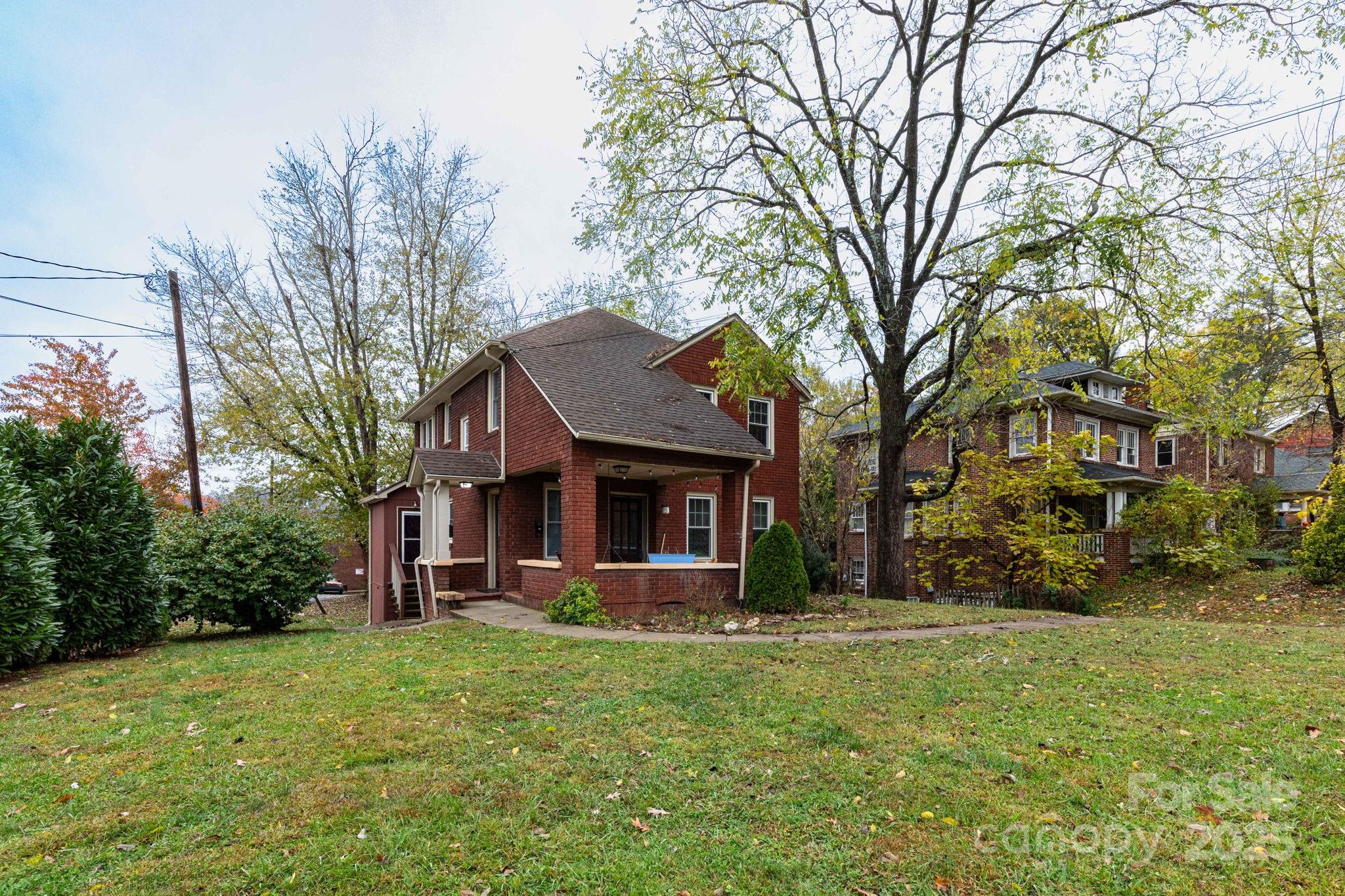 16 Gracelyn Road Asheville, NC 28804 - Photo 2 of 22 a front view of a house with garden