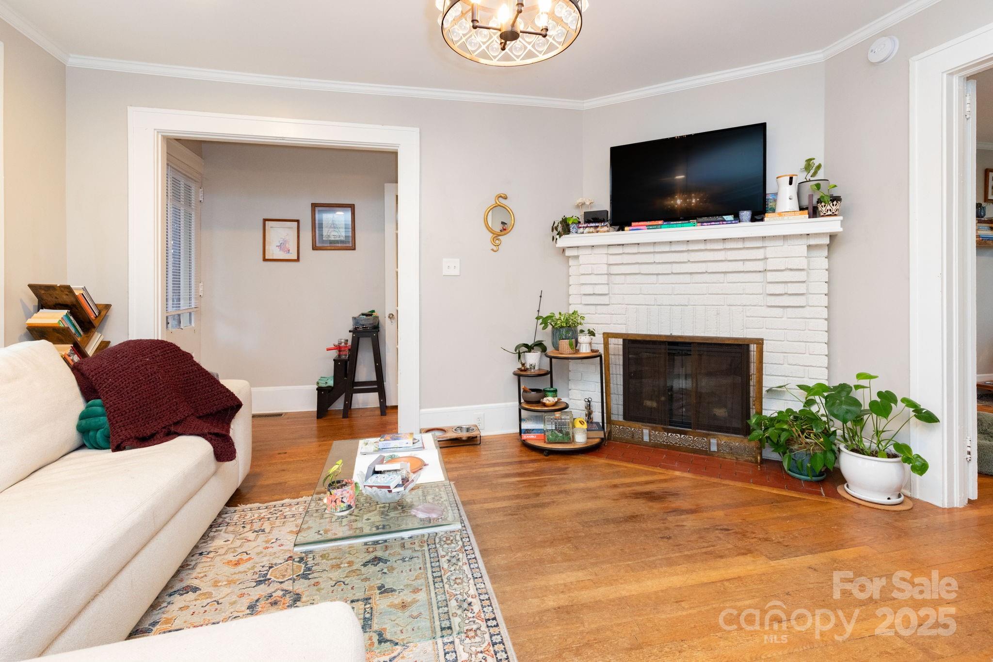 16 Gracelyn Road Asheville, NC 28804 - Photo 5 of 22 a living room with furniture and a flat screen tv