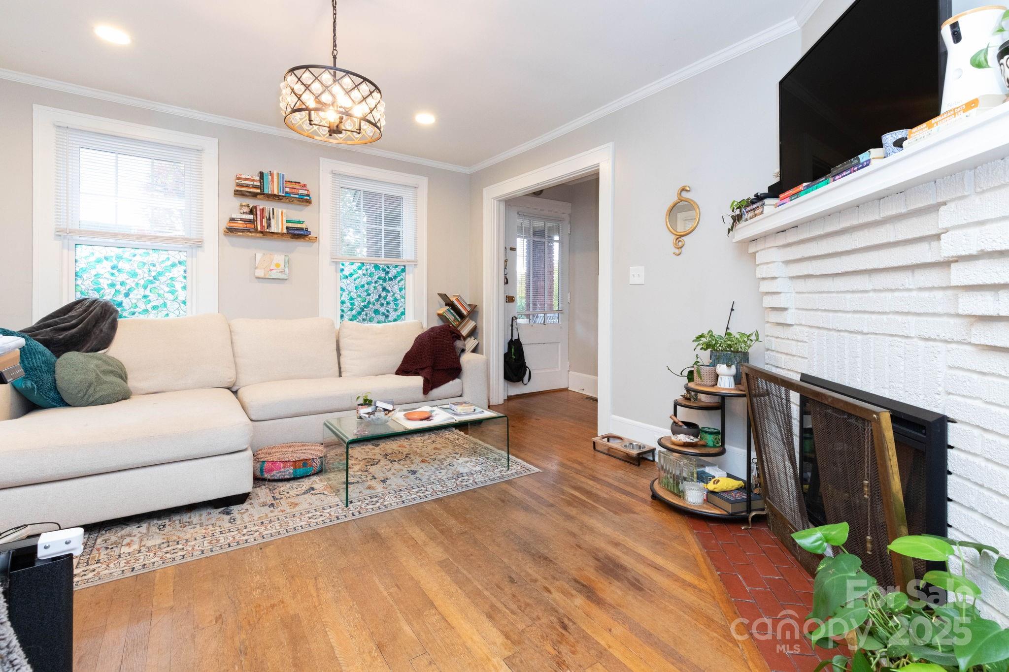 16 Gracelyn Road Asheville, NC 28804 - Photo 6 of 22 a living room with furniture fireplace and flat screen tv