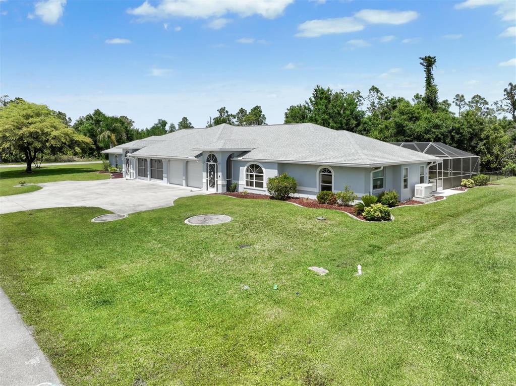 26268 Explorer Road Punta Gorda, FL 33983 - Photo 1 of 1 a front view of a house with garden