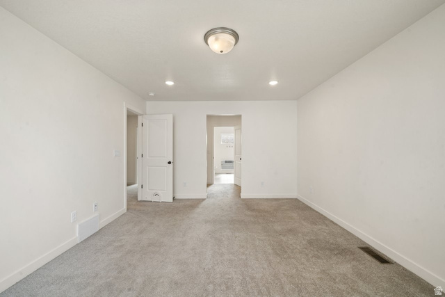 70 East Weekes Way Clearfield, UT 84015 - Photo 12 of 25 Empty room with light colored carpet and recessed lighting