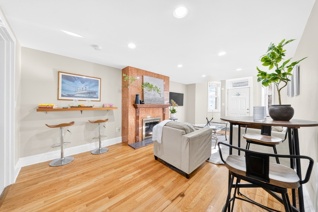 352 Tappan Street, Unit 1 Brookline, MA 02445 - Photo 3 of 42 a living room with furniture a potted plant and a table