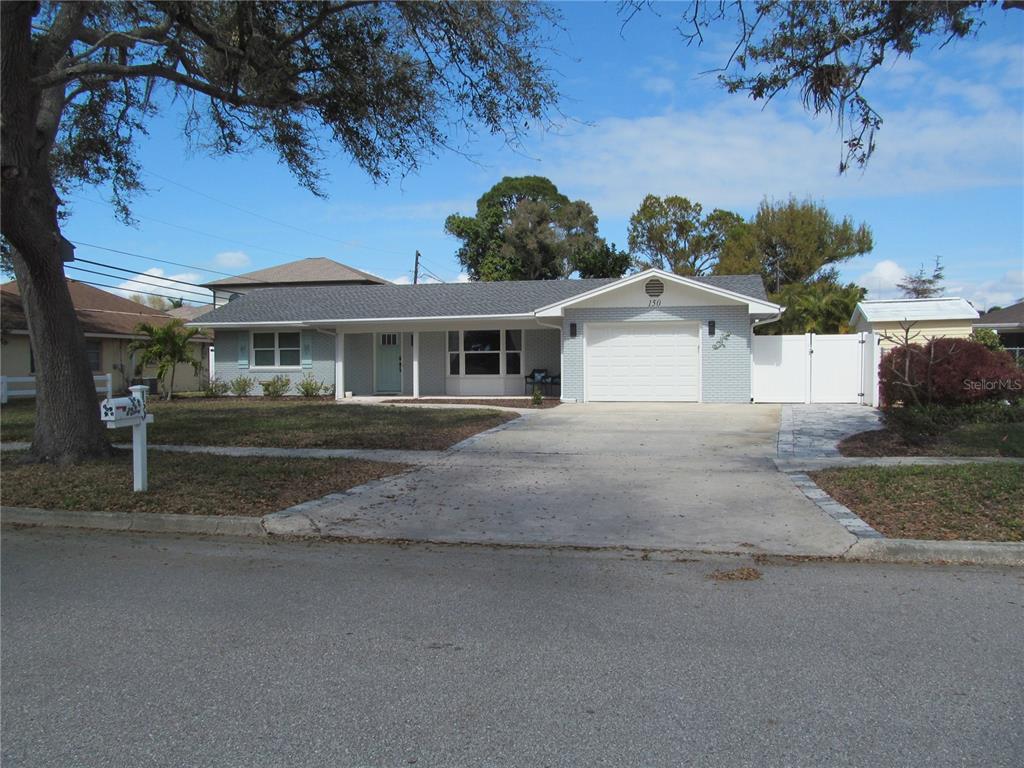 150 Fiesole Street Venice, FL 34285 - Photo 1 of 1 a front view of a house with a yard and garage