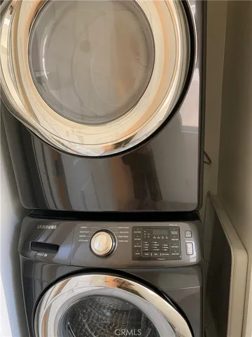 an empty room with wooden floor and closet