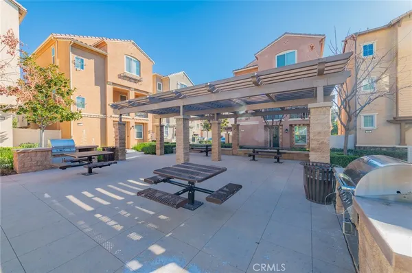a view of swimming pool with outdoor seating and a patio