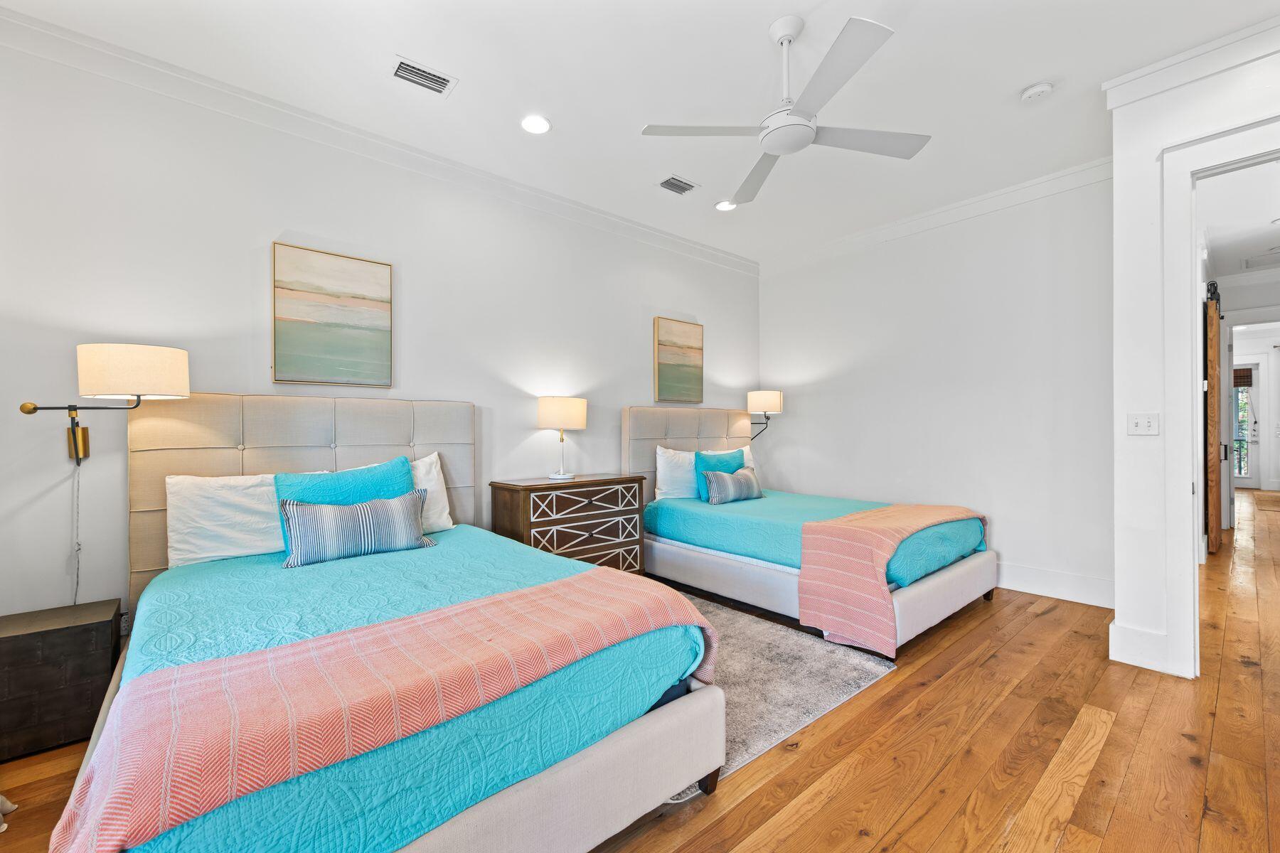 75 Lifeguard Loop West Seacrest, FL 32461 - Photo 22 of 37 a bedroom with two beds and painting on the wall