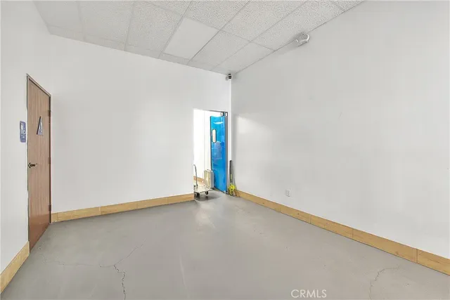 an empty room with white walls