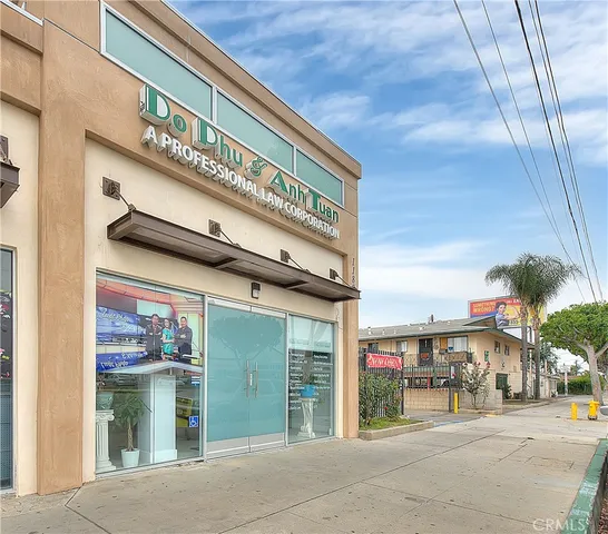 a view of a livingroom with furniture and a floor to ceiling window
