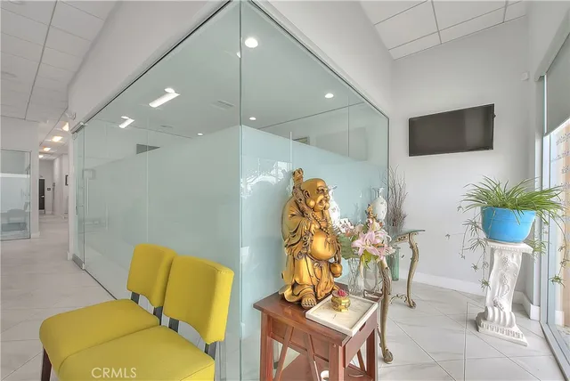a view of kitchen with furniture and a refrigerator