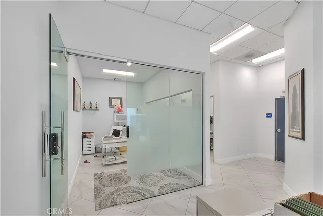 a lobby with furniture and a chandelier