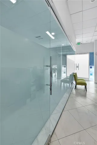 a workspace with furniture and mirror
