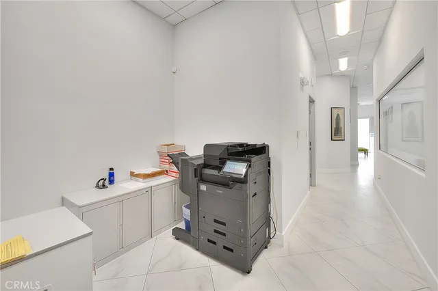 a workspace with furniture and white walls