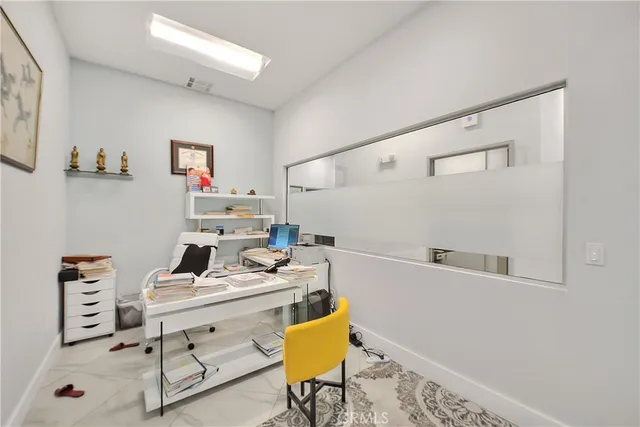 a view of workspace with wooden floor