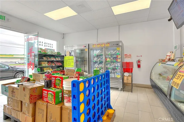 a room with lots of furniture and a large window