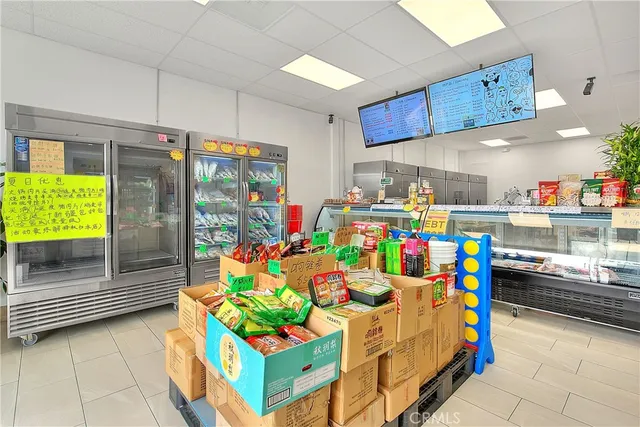 a kitchen with stainless steel appliances kitchen island granite countertop a stove a sink and a microwave