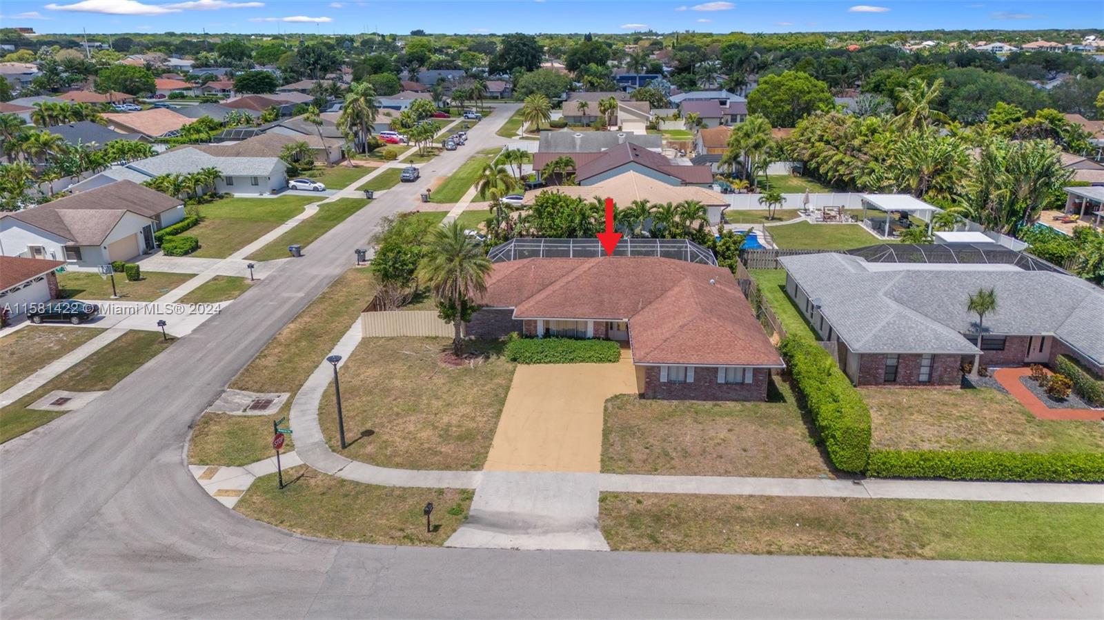 17689 Woodview Terrace Boca Raton, FL 33487 - Photo 15 of 15 an aerial view of a house with a garden and lake view