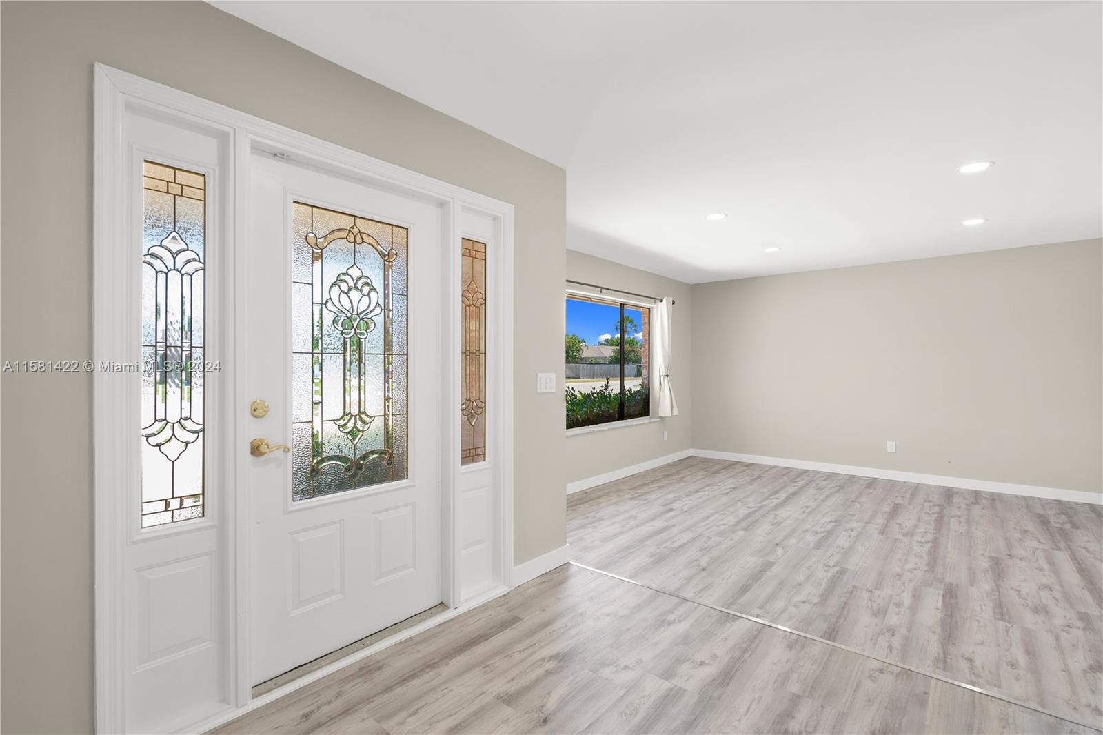 17689 Woodview Terrace Boca Raton, FL 33487 - Photo 4 of 15 a view of an empty room with a window