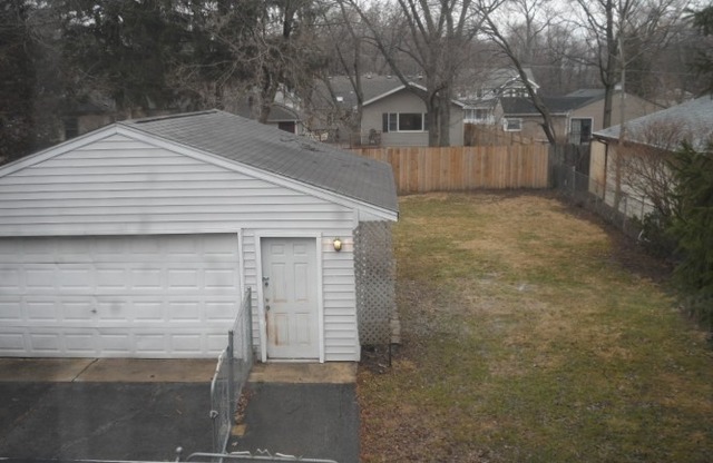 1446 Linden Road Homewood, IL 60430 - Photo 12 of 12 a front view of a house with garage