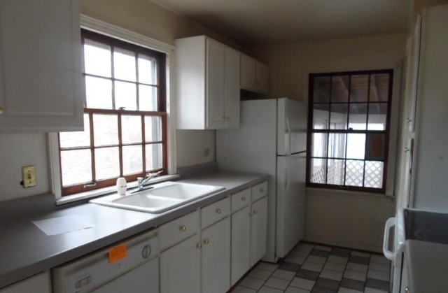 1446 Linden Road Homewood, IL 60430 - Photo 4 of 12 a kitchen with a sink refrigerator and window