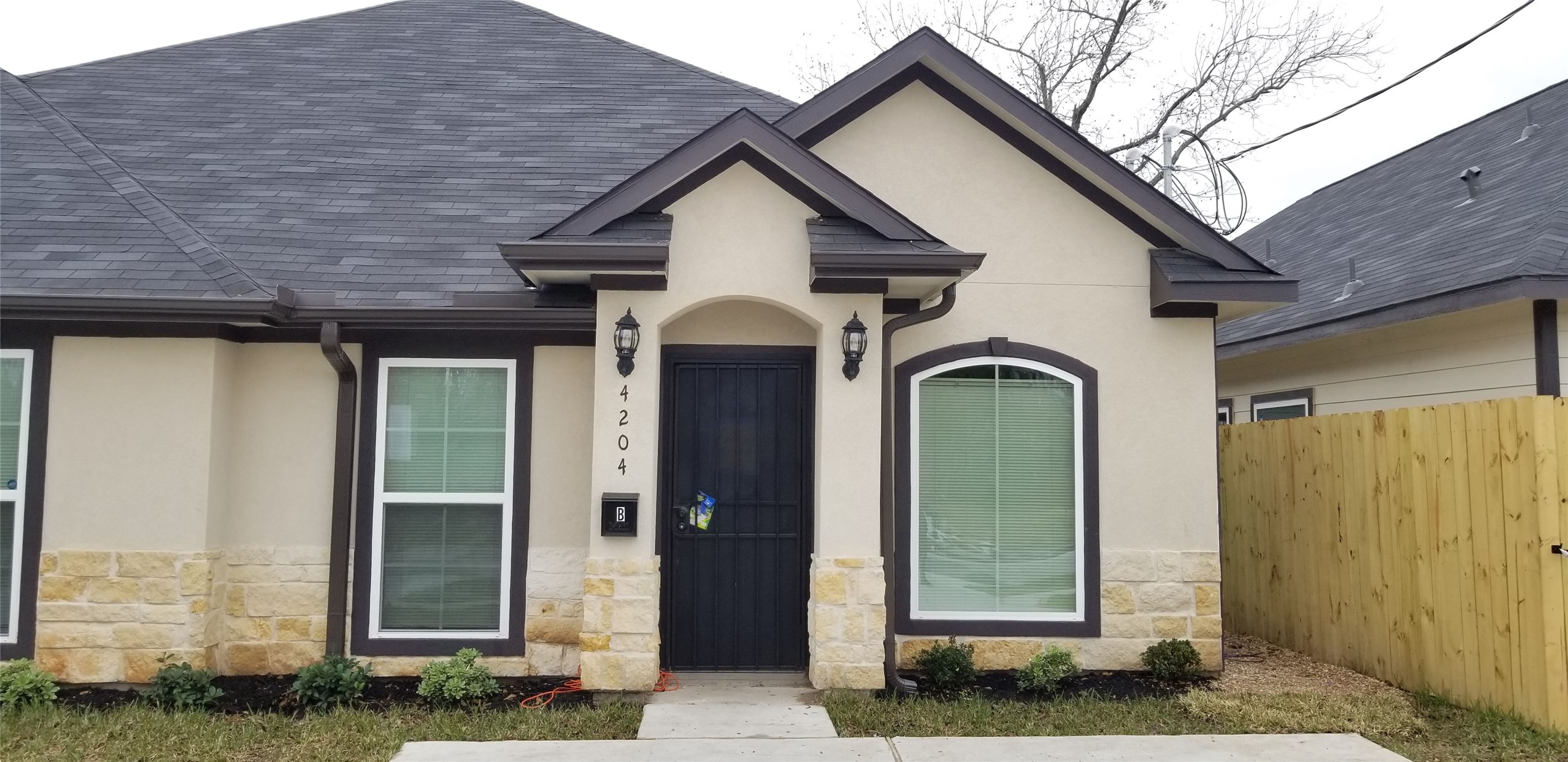 a front view of a house with a glass door
