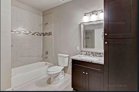 4204 Stassen Street, Unit B Houston, TX 77051 - Photo 3 of 11 a bathroom with a sink a toilet and shower