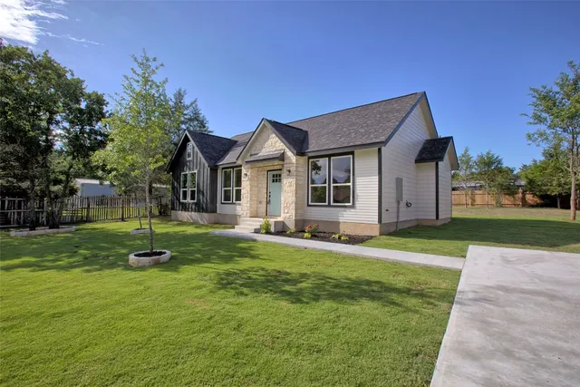 a front view of a house with a yard