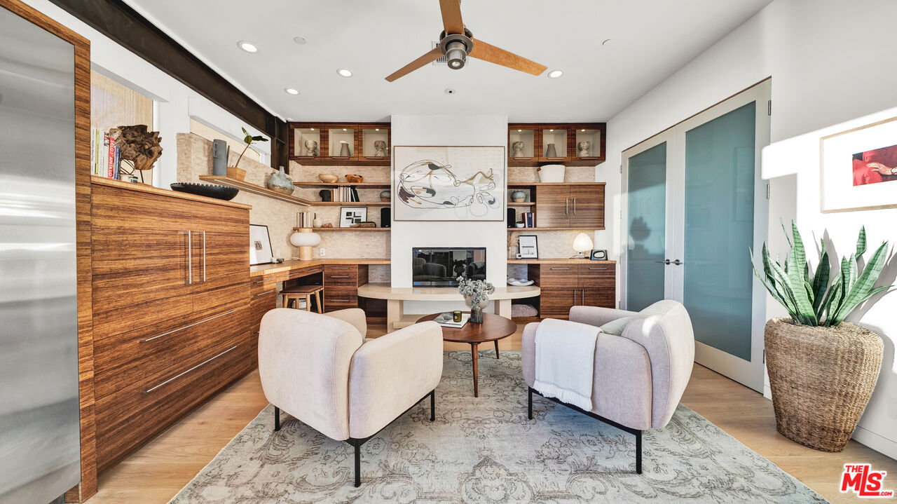 2915 Tuna Canyon Road Topanga, CA 90290 - Photo 14 of 45 a living room with furniture fireplace and a flat screen tv