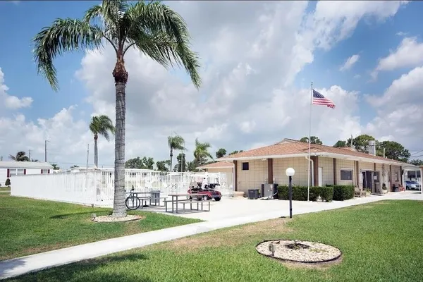 a view of a lake with houses in the back