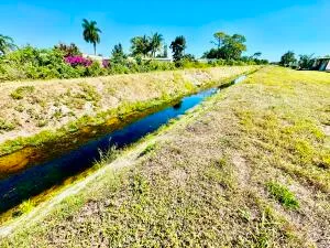 a view of a swimming pool and an outdoor seating