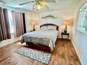 a view of a patio with table and chairs and wooden floor