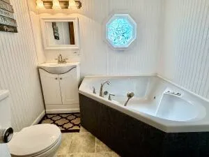 a kitchen with stainless steel appliances a stove a microwave and a refrigerator