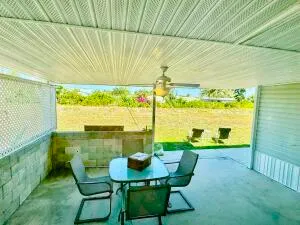 a view of a dining room with furniture and window