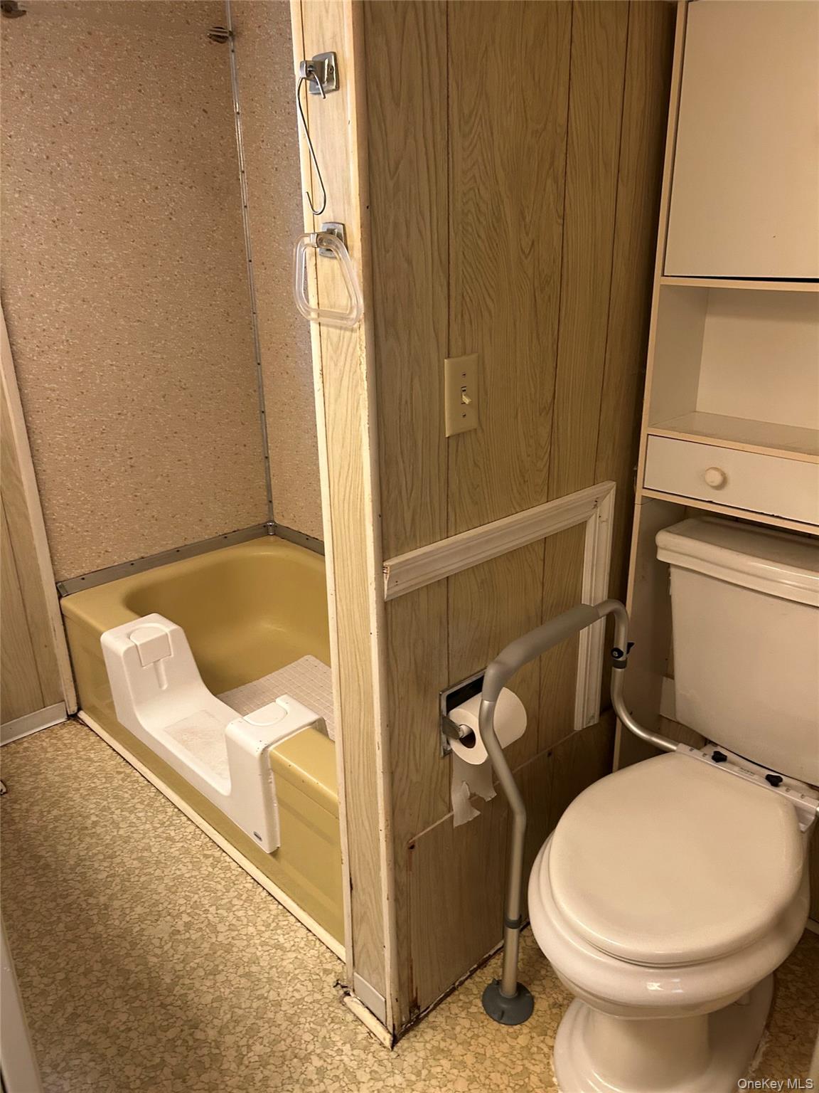 1964 River Road, Unit 37 Calverton, NY 11933 - Photo 13 of 13 a bathroom with a toilet and a sink