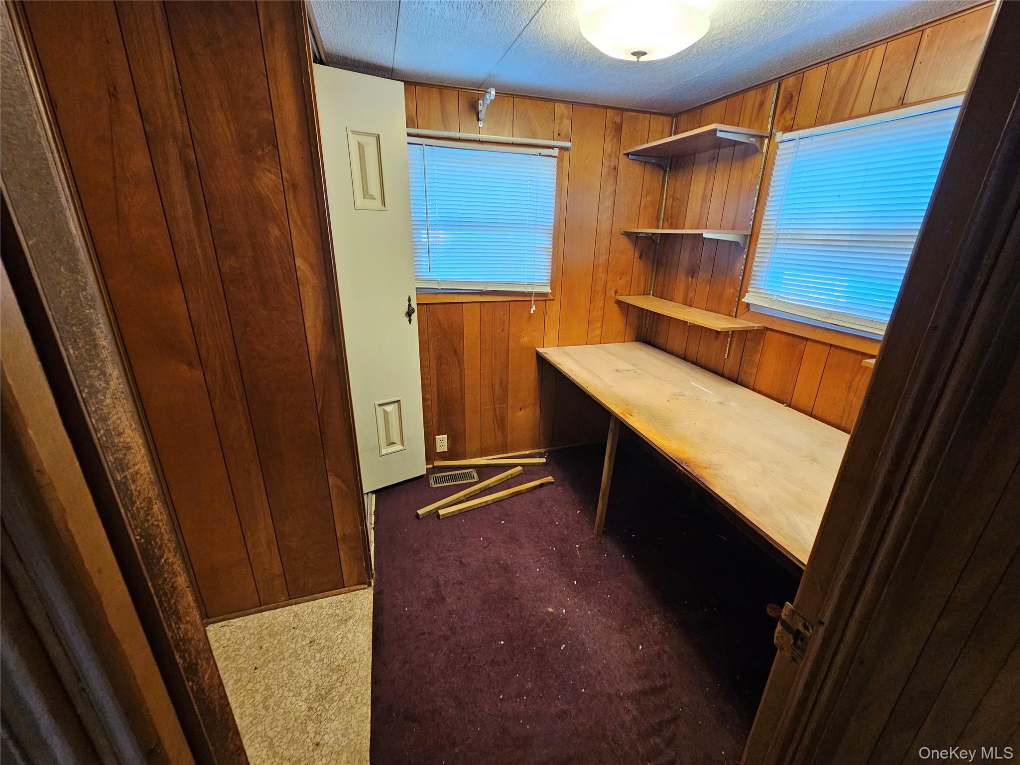 1964 River Road, Unit 37 Calverton, NY 11933 - Photo 9 of 13 a view of walk in closet with clothes