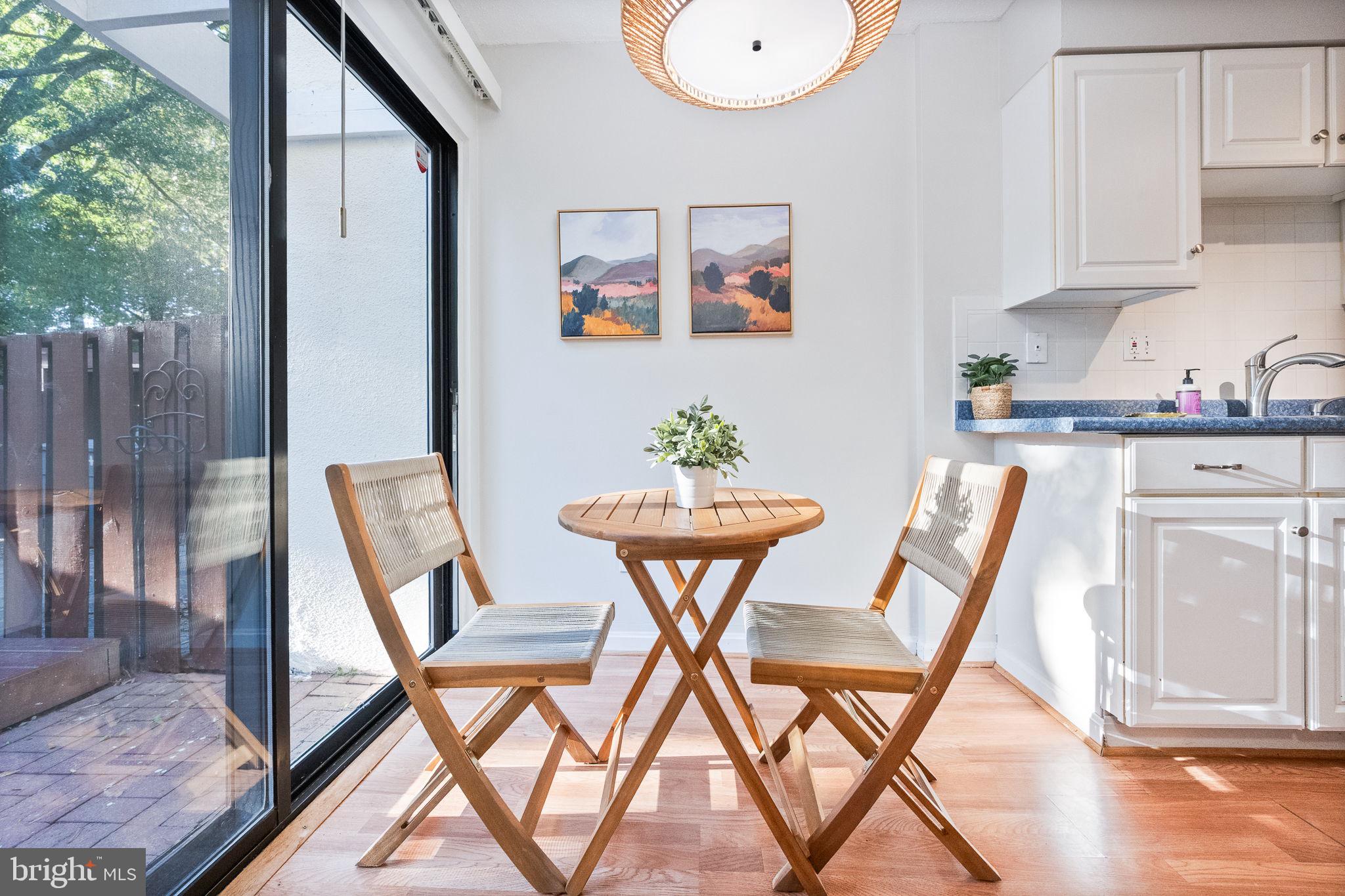 2340 Southgate Square Reston, VA 20191 - Photo 15 of 33 a view of a dining room with furniture and wooden floor